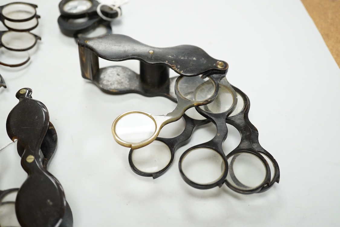 A group of 19th-century horn framed loupes, quizzing glasses and four optician multiple lens sizing lorgnettes (13)